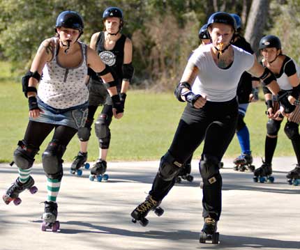Members of the Gainesville Roller Rebels roller derby team skate during a practice drill
