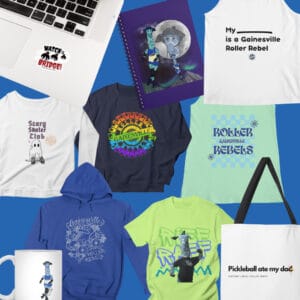 A variety of GRR merch with various designs, including stickers, shirts, a tote bag, and a mug